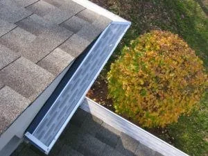 Gutter guard installation on a shingle roof