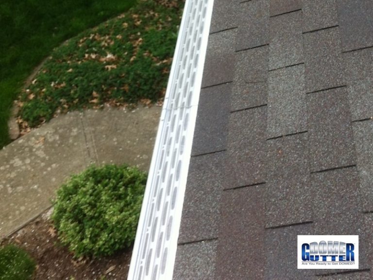 GutterDome GD45 gutter guard above a walkway on a comp shingle roof.