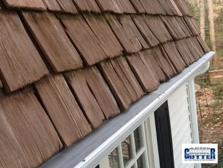 Shake roof with GutterDome gutter guard — mansard.