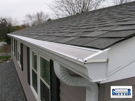 Asphalt shingle roof with GutterDome gutter guard — end cap - side view.