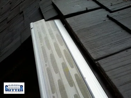 Shake roof with GutterDome gutter guard — end.