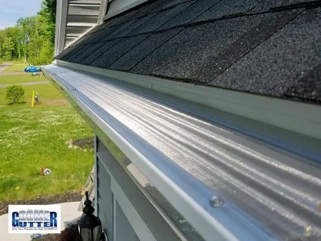 Asphalt shingle roof with GutterDome Adjustable gutter guard — straight run - close & dormer.