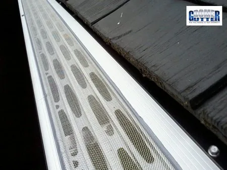 Shake roof with GutterDome Adjustable Magma gutter guard — close.