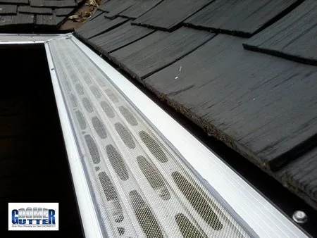 Shake roof with GutterDome Adjustable Magma gutter guard — inside corner.