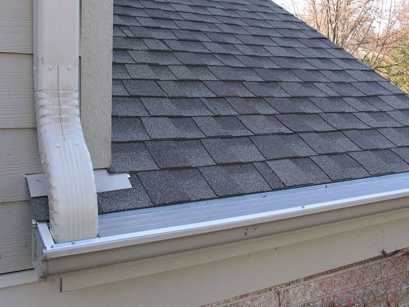 Asphalt shingle roof with GutterDome gutter guard — custom insert to 1st story gutter