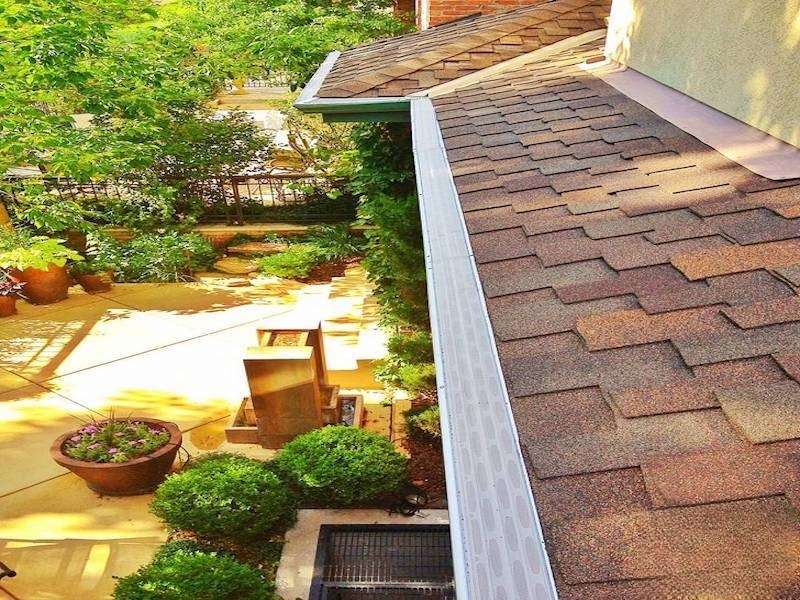 Asphalt shingle roof with GutterDome gutter guard — patio